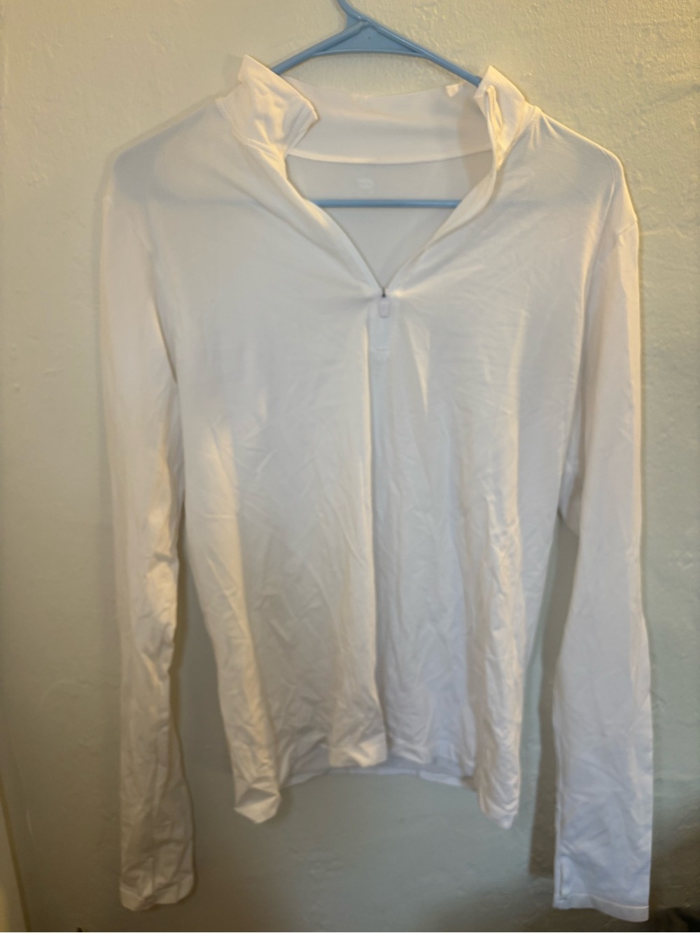 White Fabletics long sleeve performance zip up top